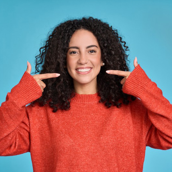 Woman happily smiling showing teeth
